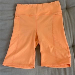 Urban Outfitters orange biker shorts